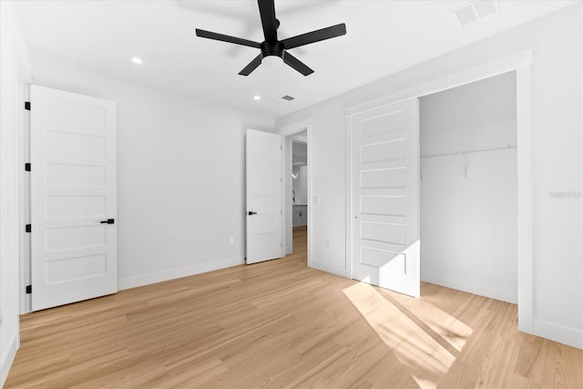 unfurnished bedroom featuring a closet, ceiling fan, and light hardwood / wood-style flooring