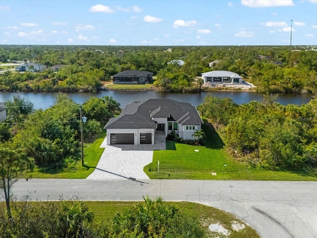 birds eye view of property with a water view