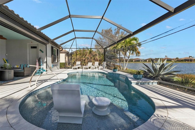 view of pool featuring a patio, a water view, and glass enclosure