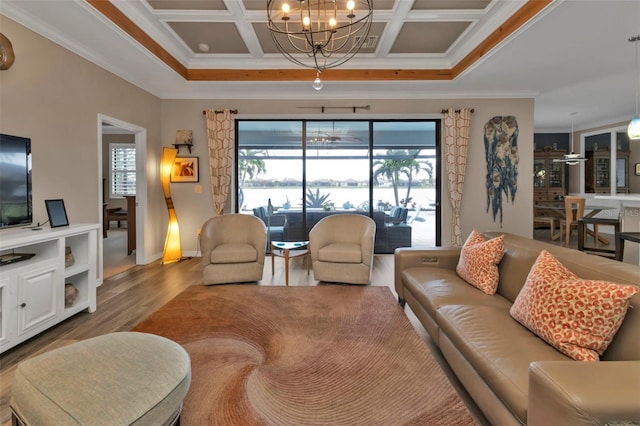 living room featuring ornamental molding, coffered ceiling, and hardwood / wood-style floors