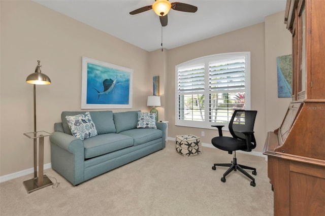 carpeted home office with ceiling fan