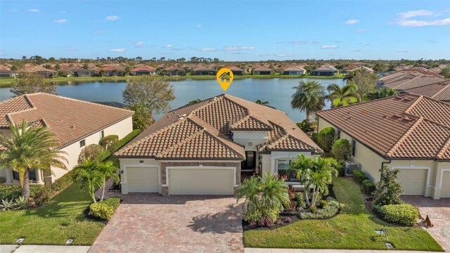 birds eye view of property with a water view