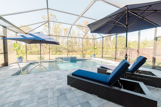 view of swimming pool with pool water feature, a lanai, and a patio area