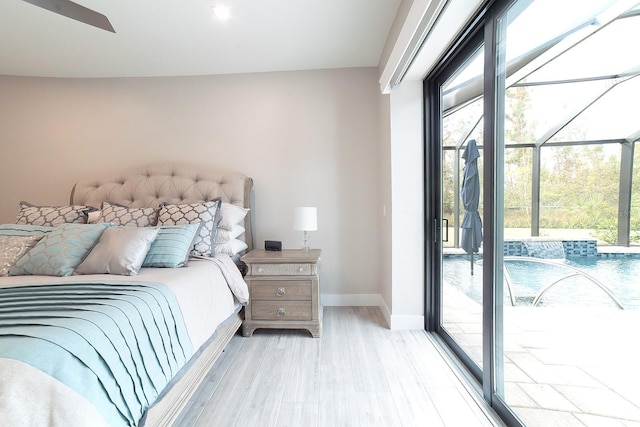 bedroom with access to exterior, ceiling fan, and light hardwood / wood-style flooring