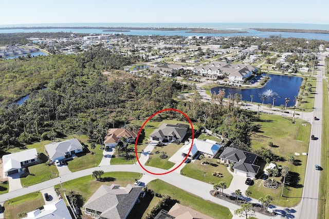 birds eye view of property with a water view