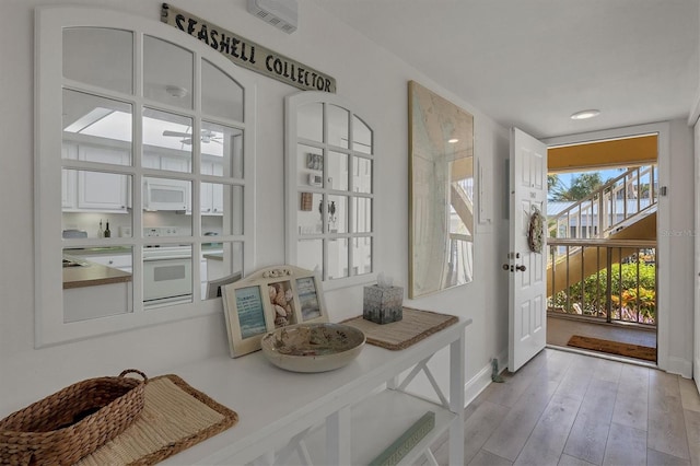 entryway with light hardwood / wood-style flooring