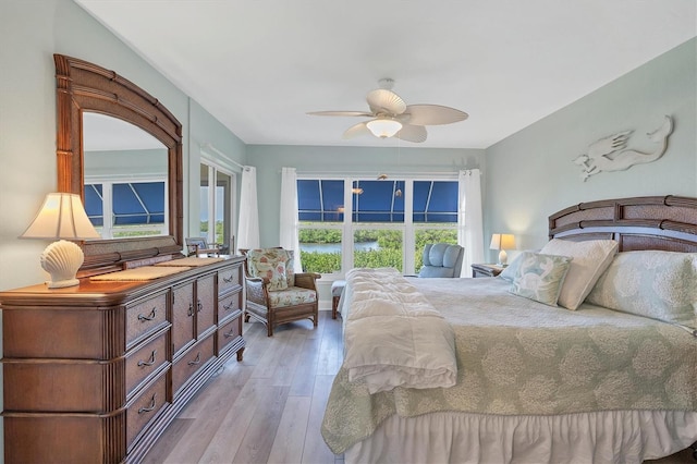 bedroom featuring light wood-type flooring and ceiling fan