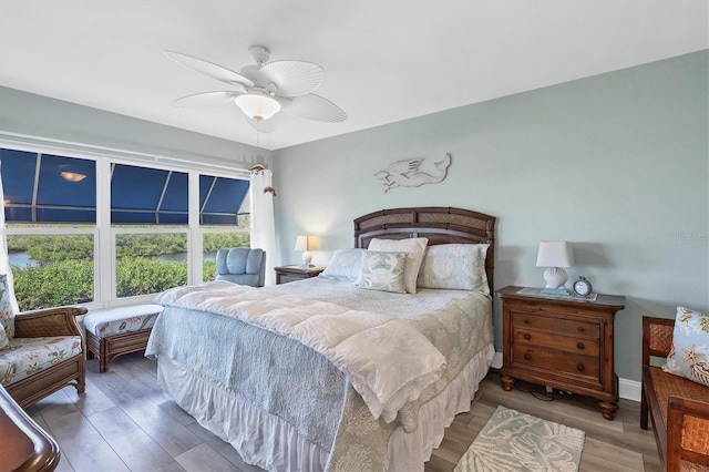 bedroom featuring ceiling fan and hardwood / wood-style floors