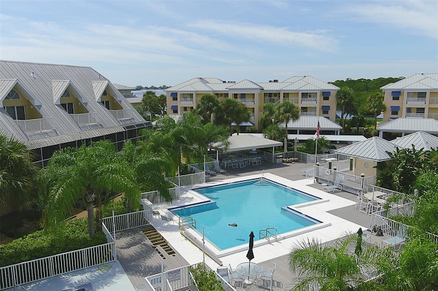 view of swimming pool with a patio