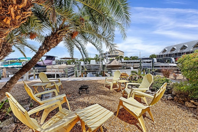 exterior space featuring a water view and a dock