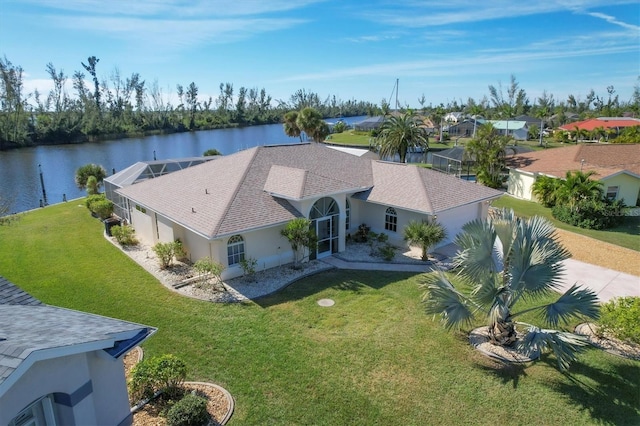 birds eye view of property with a water view