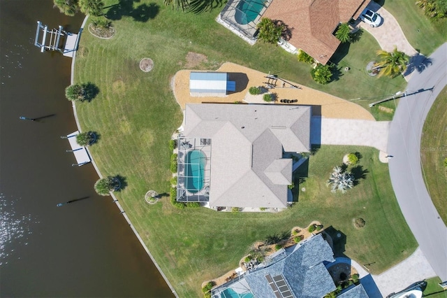 birds eye view of property with a water view