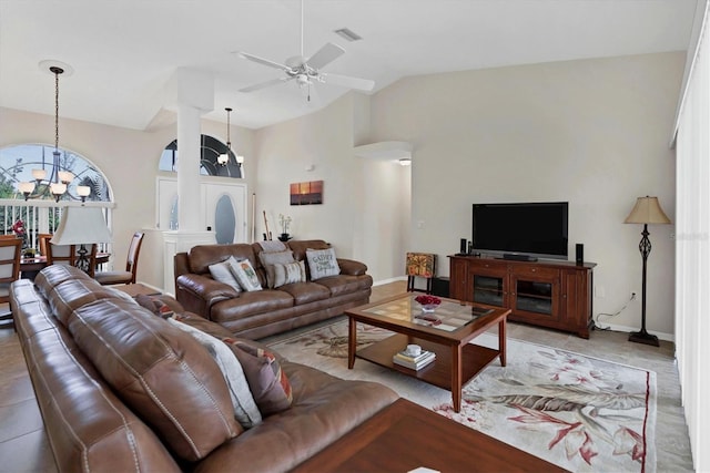 living room featuring light tile patterned floors, high vaulted ceiling, and ceiling fan with notable chandelier