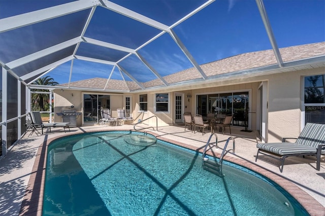 view of pool with a patio, area for grilling, and a lanai