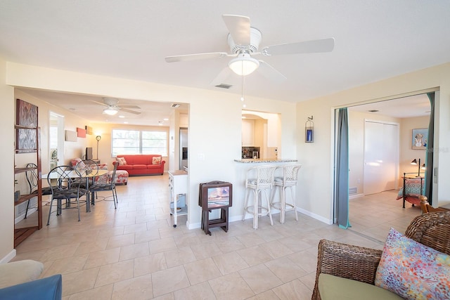 kitchen with ceiling fan and light tile patterned flooring