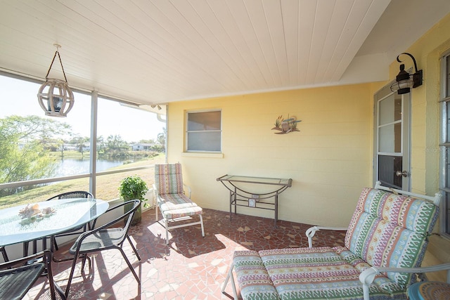 42 Caroll Cir, Englewood, FL 34223 - sunroom with a water view and outdoor dining area