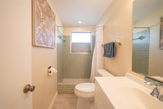 bathroom featuring tile patterned flooring, vanity, a shower with shower curtain, and toilet