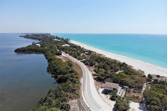 aerial view with a water view and a view of the beach