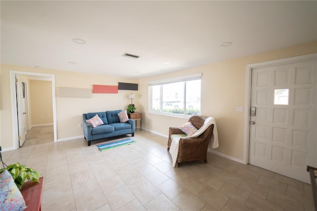 42 Caroll Cir, Englewood, FL 34223 - living room featuring baseboards and light tile patterned flooring