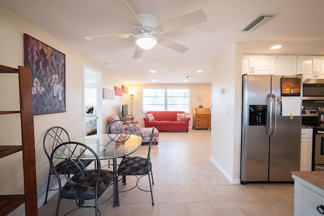 42 Caroll Cir, Englewood, FL 34223 - dining room featuring a ceiling fan, recessed lighting, and light tile patterned floors