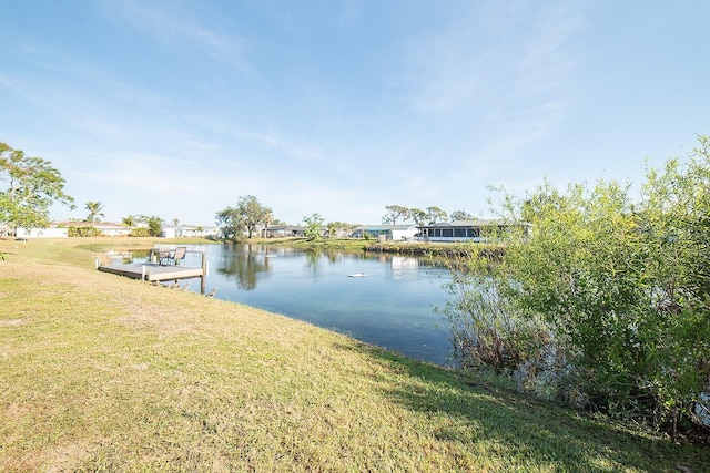 42 Caroll Cir, Englewood, FL 34223 - dock featuring a water view and a lawn