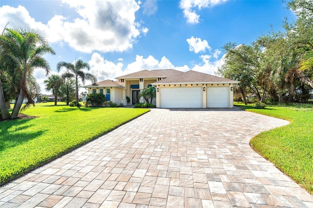 view of front facade with a front yard and a garage