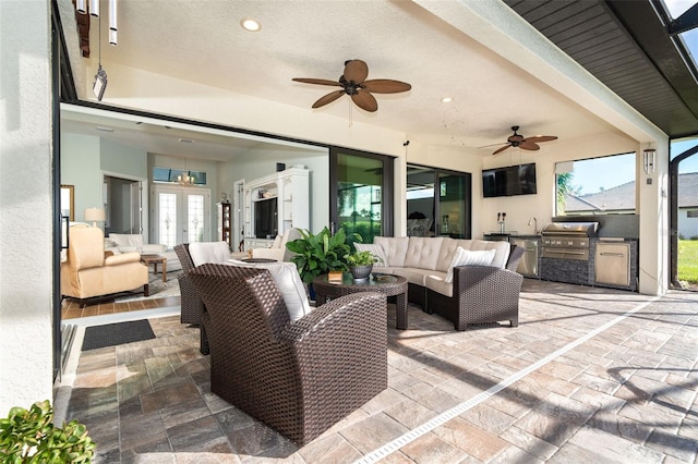 view of patio featuring outdoor lounge area, french doors, and area for grilling