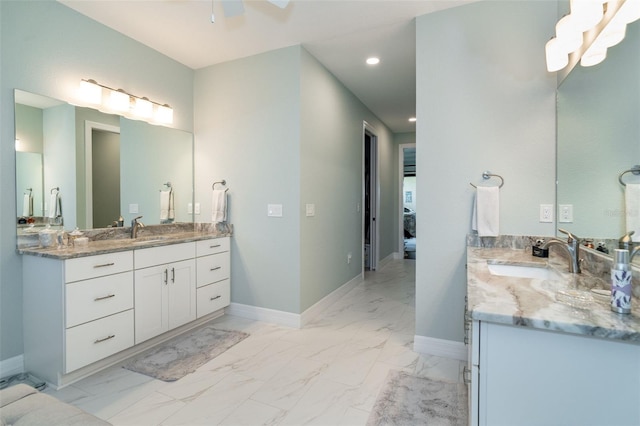 bathroom featuring ceiling fan and vanity