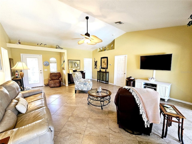 living room featuring ceiling fan and lofted ceiling