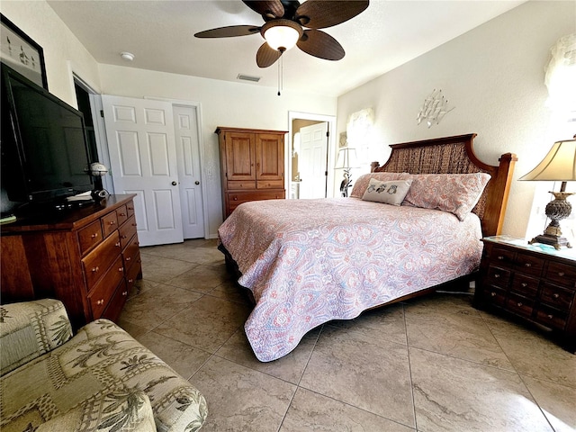 bedroom featuring ceiling fan and light tile patterned flooring