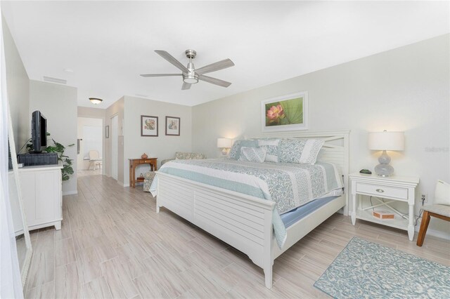 13515 Keystone Blvd, Port Charlotte, FL 33981 - bedroom with light wood finished floors, ceiling fan, and baseboards