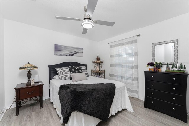 13515 Keystone Blvd, Port Charlotte, FL 33981 - bedroom with light wood-style floors and a ceiling fan