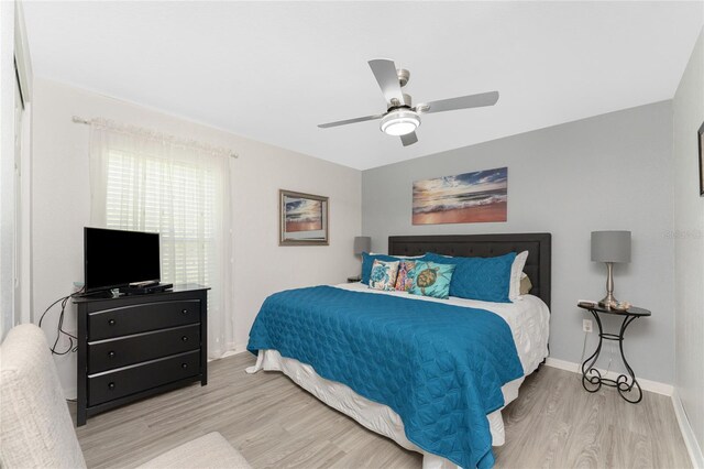 13515 Keystone Blvd, Port Charlotte, FL 33981 - bedroom with wood finished floors, a ceiling fan, and baseboards