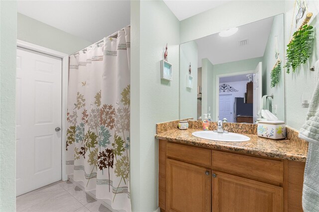 13515 Keystone Blvd, Port Charlotte, FL 33981 - full bathroom featuring vanity, a shower with shower curtain, and ensuite bath