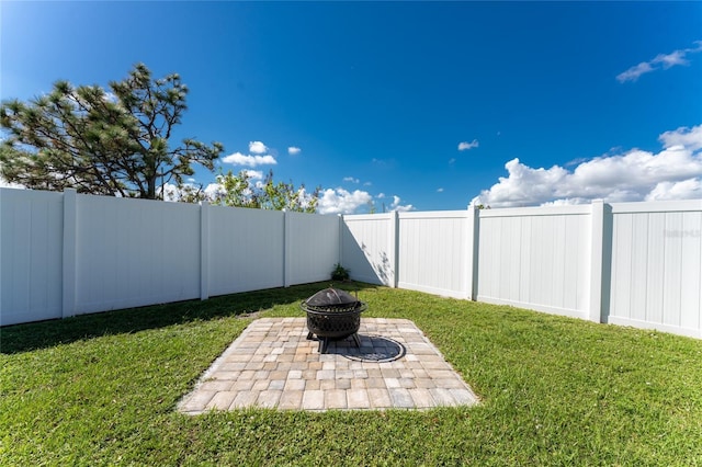 13515 Keystone Blvd, Port Charlotte, FL 33981 - view of yard featuring an outdoor fire pit and a patio