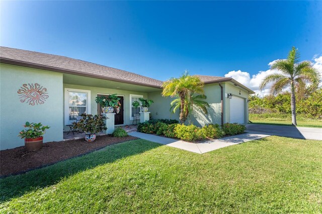13515 Keystone Blvd, Port Charlotte, FL 33981 - ranch-style house with driveway, stucco siding, a garage, and a front yard