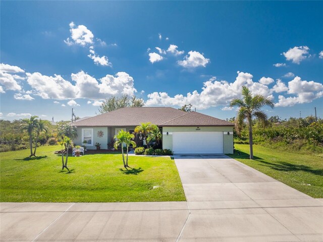 13515 Keystone Blvd, Port Charlotte, FL 33981 - ranch-style house with an attached garage, a front yard, driveway, and stucco siding