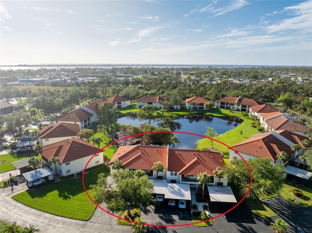 birds eye view of property featuring a water view