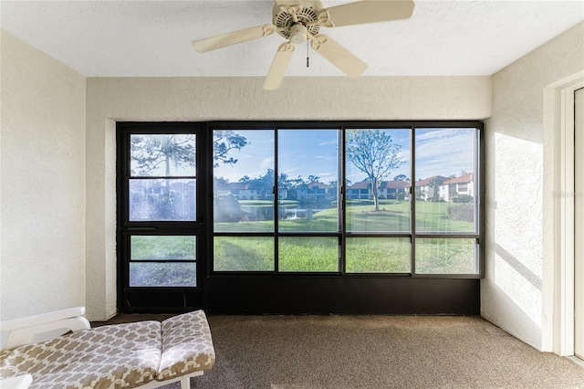 sunroom / solarium with ceiling fan