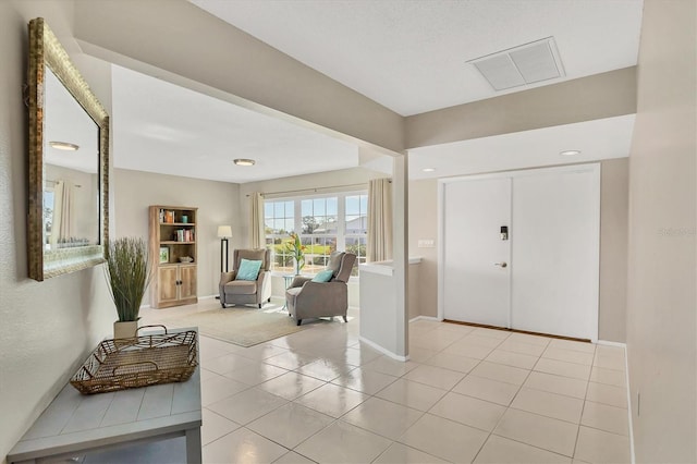 entrance foyer with light tile patterned flooring