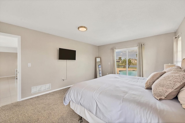 bedroom featuring carpet flooring and access to exterior