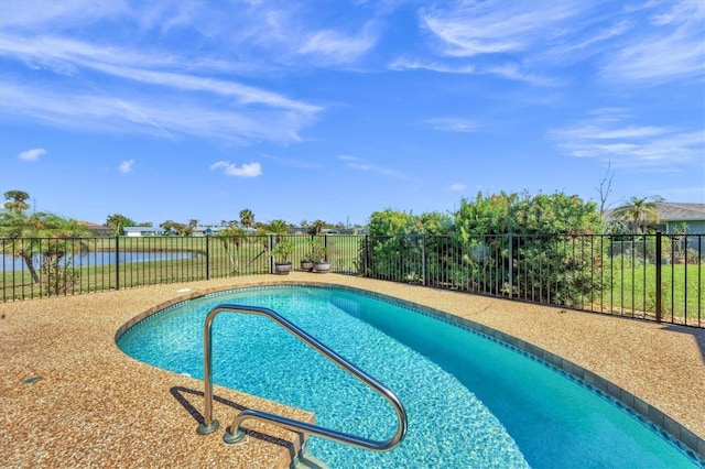 view of pool featuring a water view