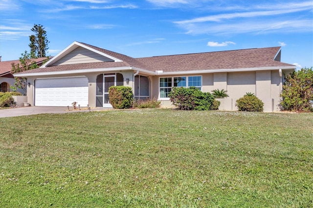 ranch-style house with a garage and a front lawn