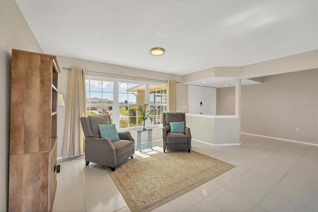 sitting room featuring light tile patterned floors