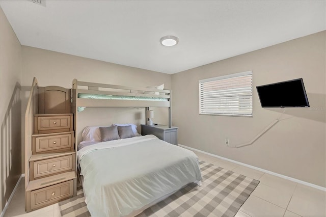 bedroom with light tile patterned floors