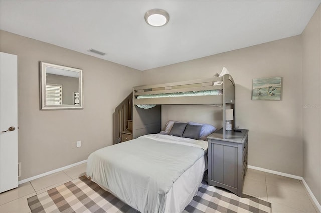 bedroom featuring light tile patterned floors