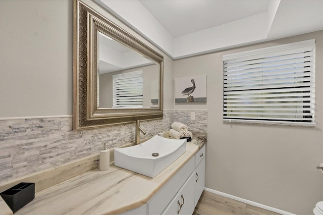 bathroom with hardwood / wood-style floors and vanity