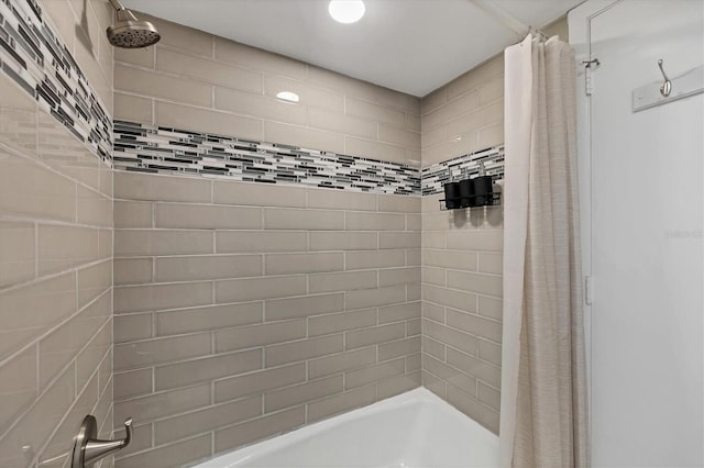 bathroom with shower / bathtub combination with curtain