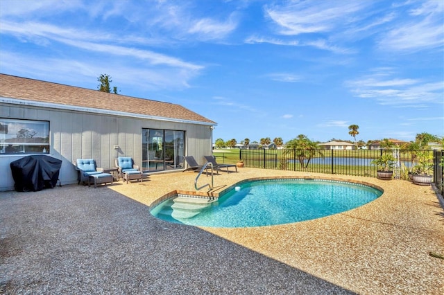 view of swimming pool featuring area for grilling and a patio