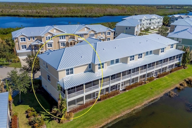 drone / aerial view with a water view